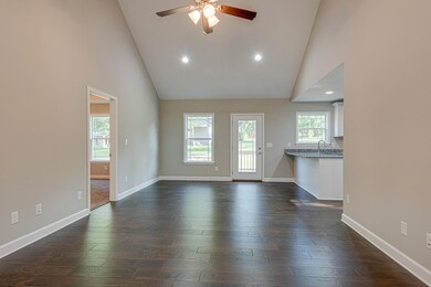 This is the same plan being built. Photo is taken from another build. Buy now and help select your finishes. You'll love the open floor plan and towering ceiling.