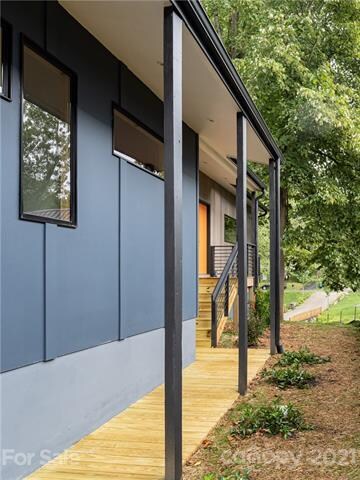 Custom metal deck rails and posts for a sleek modern style.