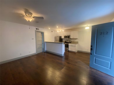 Kitchen with visible vents, a peninsula, stainless