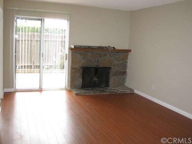 Living room with fireplace and another sliding gla