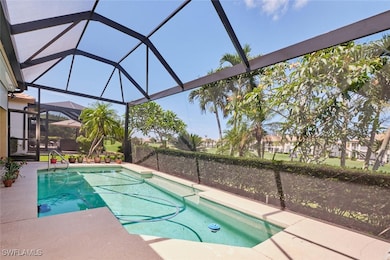 Outdoor pool with a patio and a lanai
