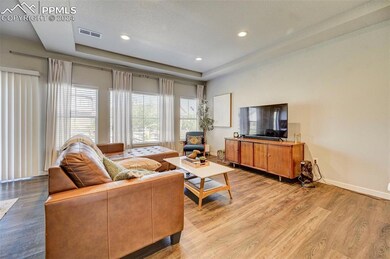 Living room featuring a textured ceiling, a tray c