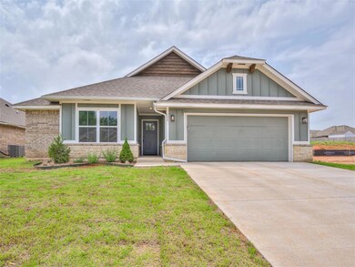 View of front of home with a garage, a front yard,
