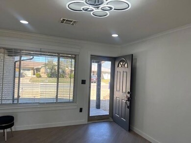 Foyer with plenty of natural light, visible vents,