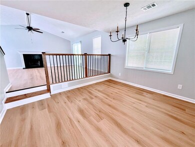 Unfurnished room with vaulted ceiling, ceiling fan