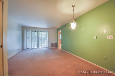Living room exits onto private patio