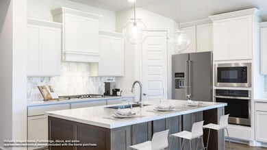 Kitchen with appliances with stainless steel fini