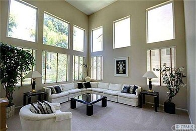 Living room is light and bright with high ceilings