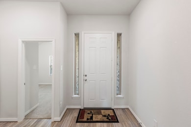 To the right of the front door is a spacious bedro
