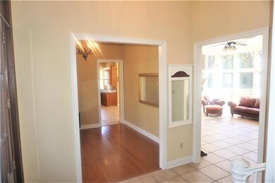 Foyer to Formal Dining and Den.