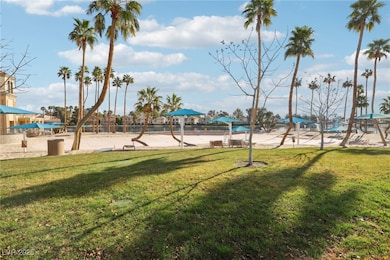 View of property's community with a yard
