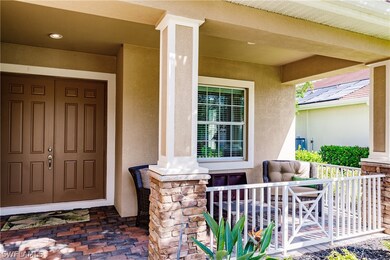 Entrance to home with stone column feature one of