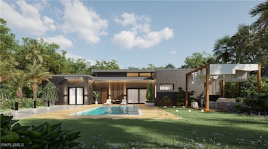 Back of house with stucco siding, stairs, and a la
