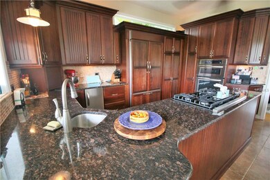 Kitchen-Granite Countertops-Cherry Cabinetry-Ice m