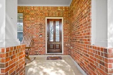 Front porch is pushed back for added privacy.