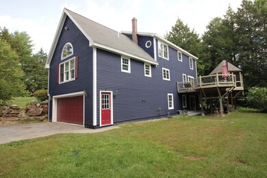 This house towers over the back yard