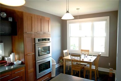 Beautify eat-in Kitchen with concrete countertops and stainless appliances