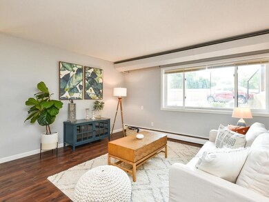 Large living space with new flooring throughout