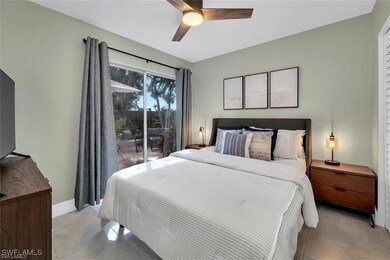 Bedroom featuring light tile patterned floors, bas