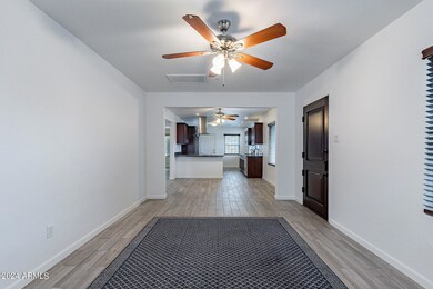 Front living room with galley kitchen