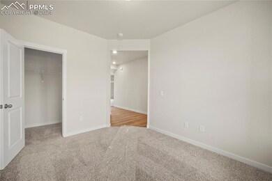 Unfurnished bedroom featuring light carpet and a c