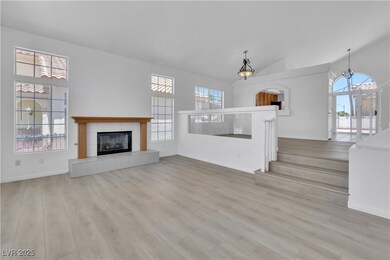 Unfurnished living room featuring a fireplace, hig