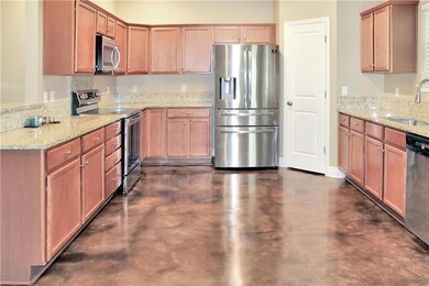 kitchen w/granite & stainless appliances