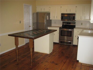Kitchen has oversized island, walk-in pantry plus 