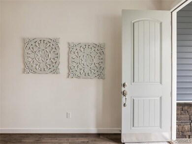The elegant entrance foyer features 10' ceilings &