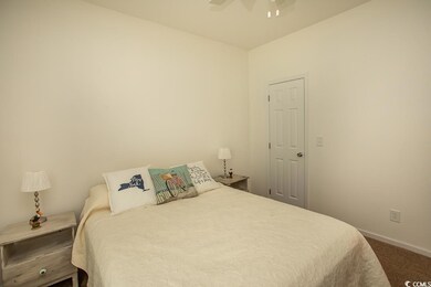 Bedroom featuring carpet and ceiling fan