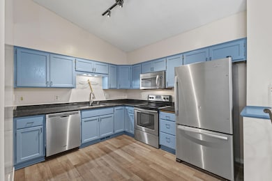 This modern kitchen features beautiful granite countertops and S/S appliances!