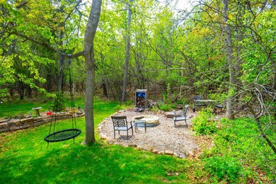 View of green lawn with a patio