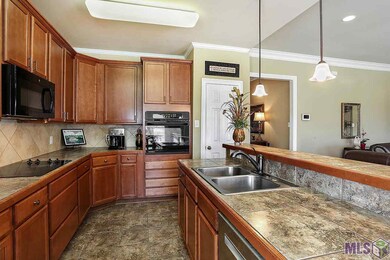 Well laid out with deep wood tone cabinets with a 