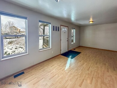 Foyer entrance featuring light hardwood / wood-sty