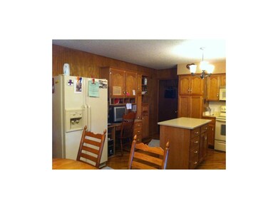 Cabinetry and parquet floors create pleasant kitch