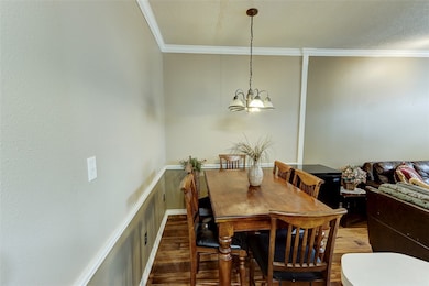 Dining area featuring wood finished floors, orname
