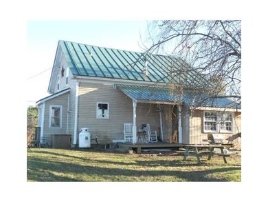 Exterior Back. new sunroom with...