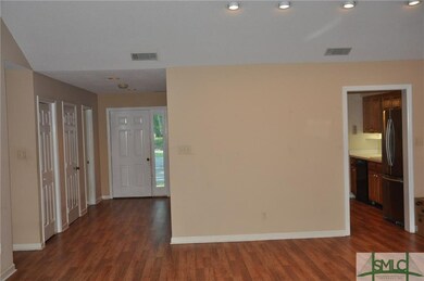 Living Room opens to the Foyer and the Kitchen