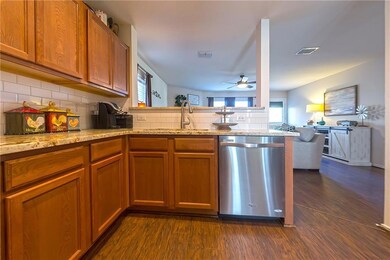 Kitchen overlooks the living area, so no one misse