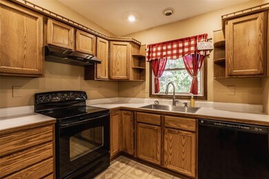 Kitchen with all newer appliances and breakfast bar.