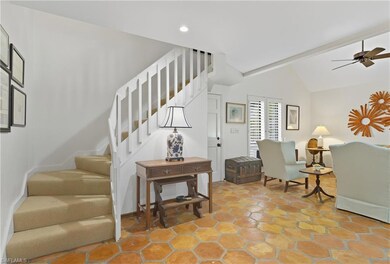 Staircase featuring a ceiling fan