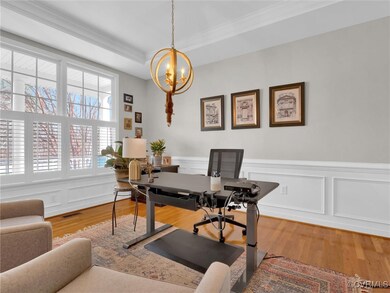 Office featuring hardwood / wood-style floors, a r