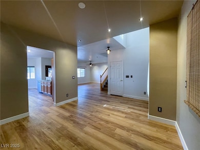 Den/Dining room with stairway, light wood-type flo