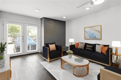 Living area with french doors, wood finished floo