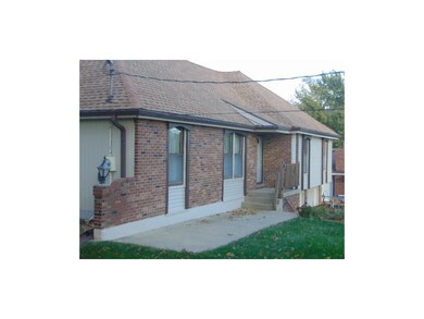 new siding & alot of brick trim