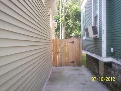 Exterior Front SIDE ENTRY TO YARD; FULL STOCKADE F