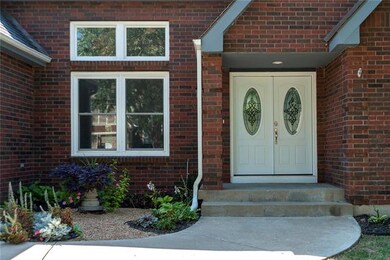 Brand new front doors and entryway landscaping.