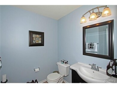 The half bath has been remodeled with new vanity, 