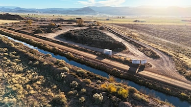 Aerial view of sparsely populated area featuring a mountain backdrop