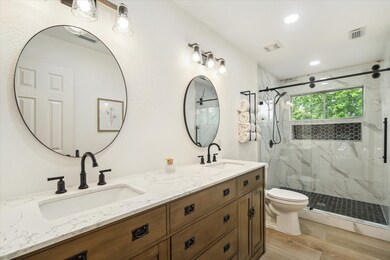 This beautifully renovated upstairs bathroom is a